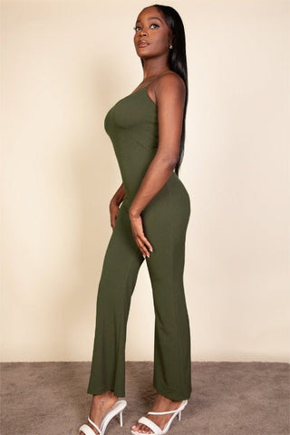 Model wearing ribbed sleeveless wide leg jumpsuit with spaghetti straps, made from stretch rib knit fabric in olive green color.