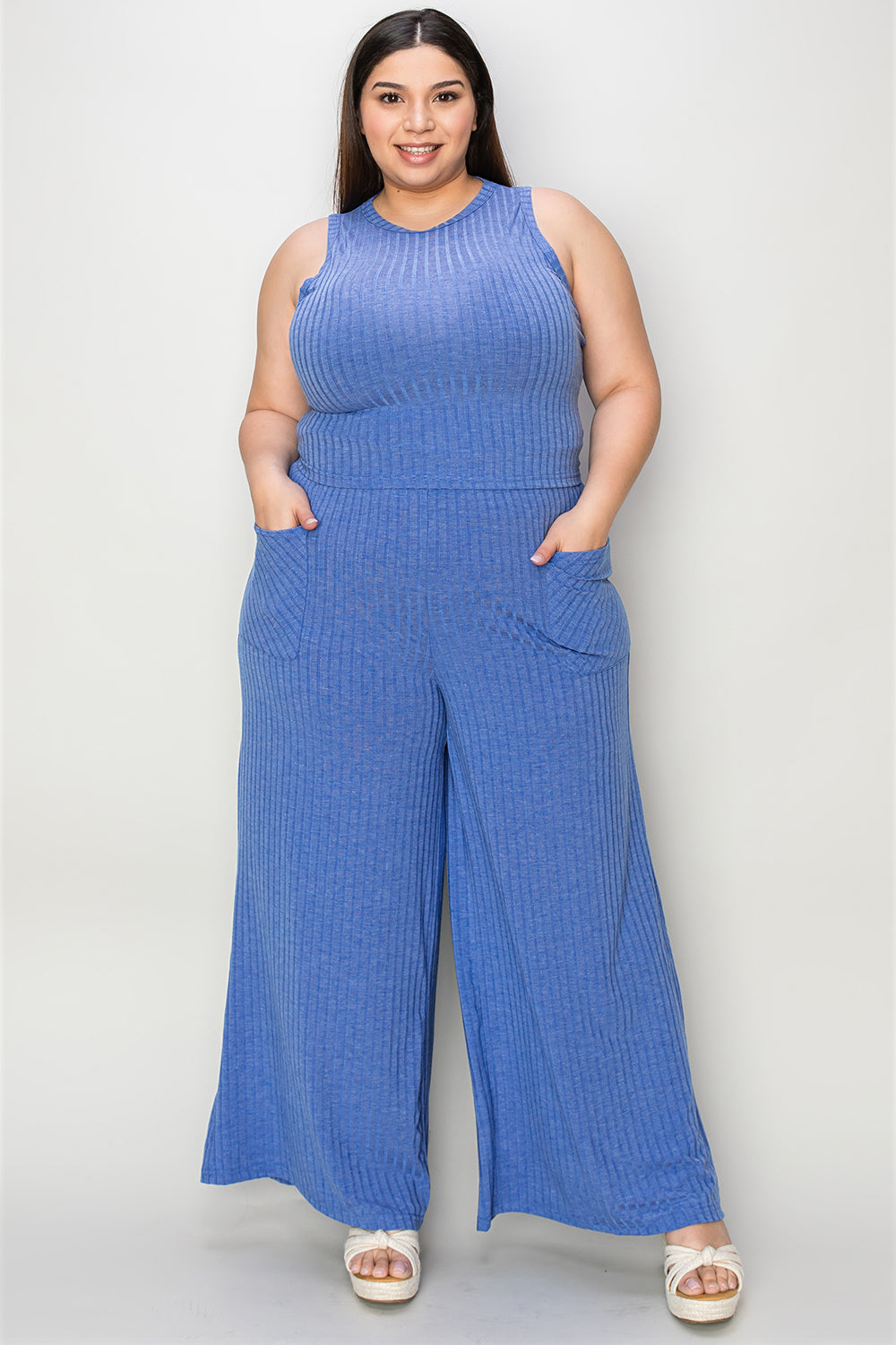 Ribbed tank and wide leg pants set in blue with frill and pockets, showcasing moderate stretch for comfort and style.