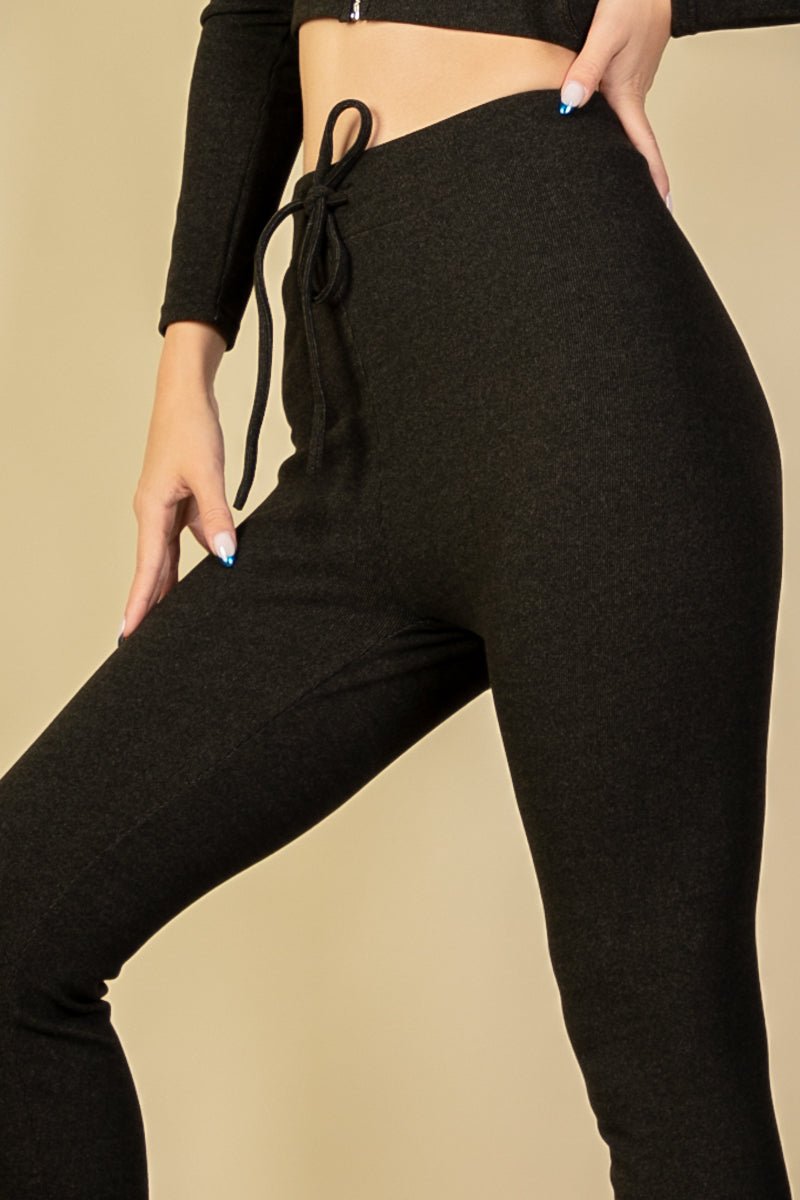 Ribbed tie front leggings in brushed two-tone fabric with elastic drawstring waist, showcasing comfortable and stylish design.