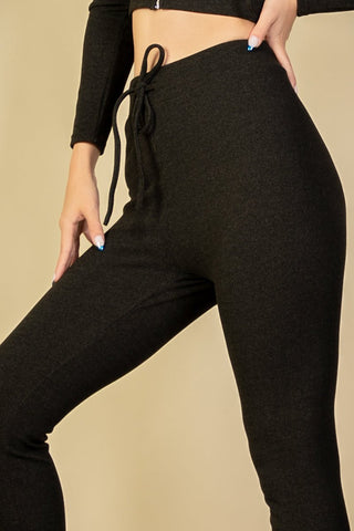 Ribbed tie front leggings in brushed two-tone fabric with elastic drawstring waist, showcasing comfortable and stylish design.