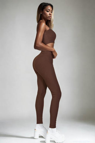 Brown ribbed tube top and leggings set made of polyester and spandex, worn by a woman with white platform shoes.