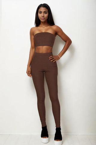 Model wearing a ribbed tube top and leggings set in brown, featuring a bodycon fit, made of 92% polyester and 8% spandex.