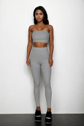 Model wearing ribbed tube top and leggings set in gray, featuring a bodycon fit made of polyester and spandex blend.