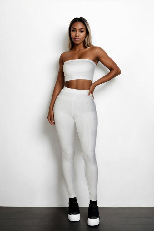 Woman wearing a white ribbed tube top and leggings set made of 92% polyester and 8% spandex, showcasing bodycon style.