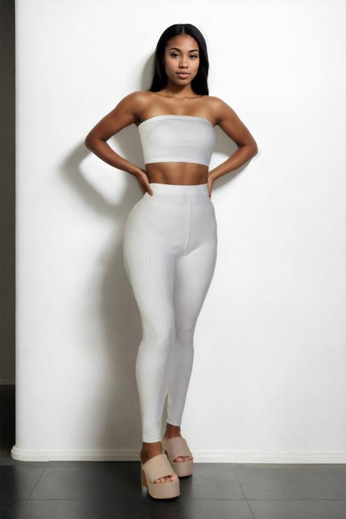 Model wearing a white ribbed tube top and leggings set, polyester and spandex bodycon outfit. Perfect for fashion and style.