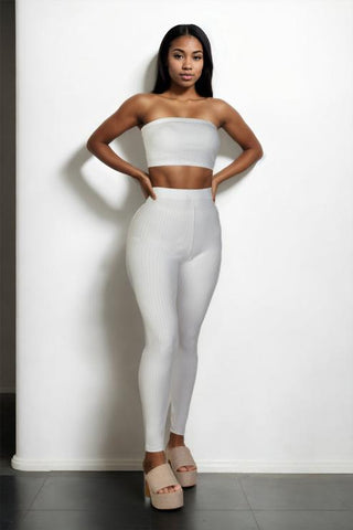Model wearing a white ribbed tube top and leggings set, polyester and spandex bodycon outfit. Perfect for fashion and style.
