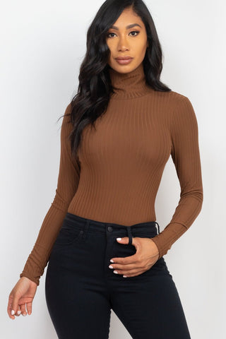 Ribbed turtle neck long sleeve bodysuit in brown, worn by a model. Soft, high stretch fabric with polyester and spandex. Model 5'8"