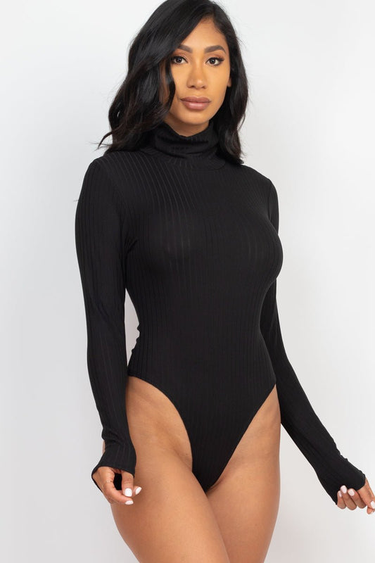Model wearing black ribbed turtle neck long sleeve bodysuit, made from high-stretch polyester and spandex blend.