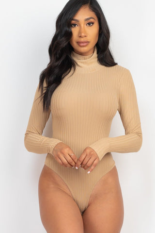 Model wearing beige ribbed turtle neck long sleeve bodysuit, highlighting soft and lightweight high stretch fabric.