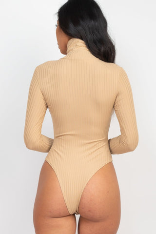 Ribbed turtle neck long sleeve bodysuit in beige, featuring high stretch fabric and seamless design, rear view.