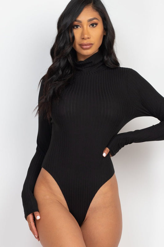 Model wearing black ribbed turtle neck long sleeve bodysuit with high stretch rib knit fabric, perfect for chic fashion styling.