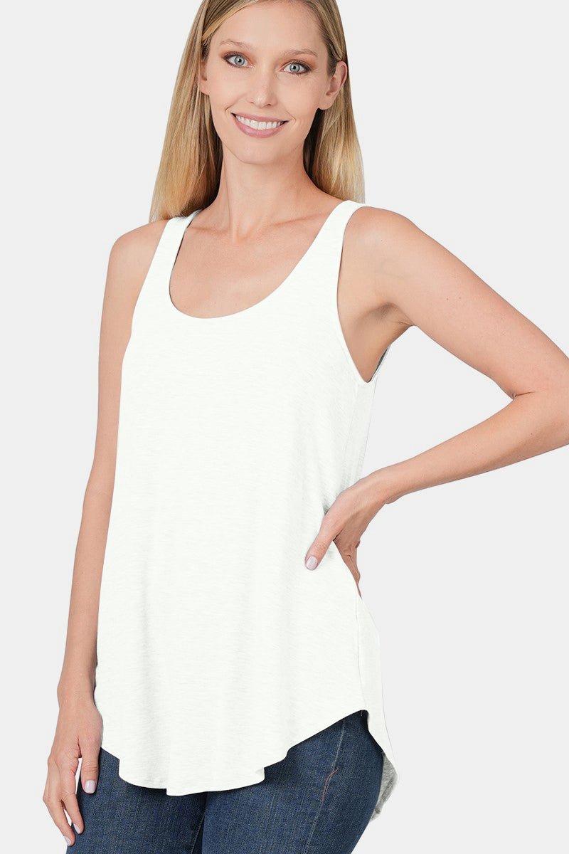 Woman wearing a chic round neck curved hem tank top in white with a flattering silhouette, perfect for casual or night wear.