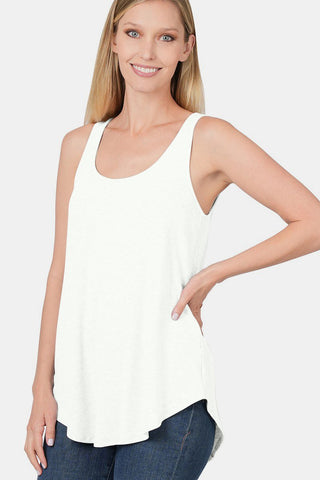 Woman wearing a chic round neck curved hem tank top in white with a flattering silhouette, perfect for casual or night wear.