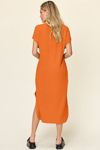 Orange round neck short sleeve slit dress, slightly stretchy, opaque polyester spandex blend, stylish and comfortable fashion.