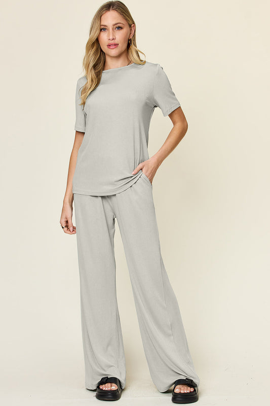 Stylish round neck short sleeve t-shirt and wide leg pants set in gray, featuring a basic style and slightly stretchy fabric.