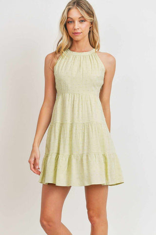 Sage halter round-neck sleeveless dress with buttoned back keyhole and pompom textures, featuring a three-layered mini hemline.