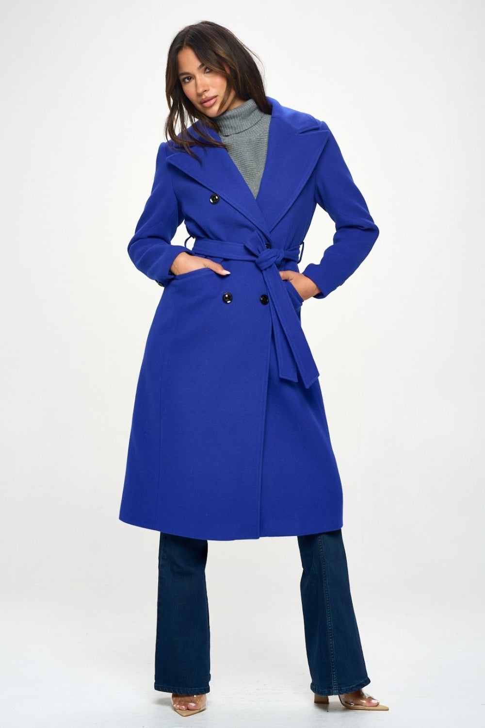 Woman wearing LA Double-Breasted Longline Belted Coat in Royal Blue, showcasing elegant and timeless style.