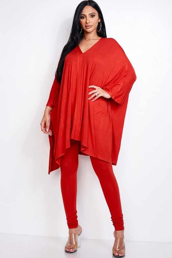 Rust-colored cape top and leggings set made from rayon-spandex blend, worn by model, showcasing USA-made two-piece outfit.