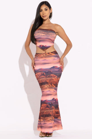 Woman wearing rust printed tube top and maxi skirt set made of polyester and spandex, stylish outfit for day to night comfort.