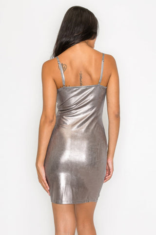 Silver scoop neck foil mini dress with adjustable straps, shown from the back, highlighting bodycon fit and shimmering finish.