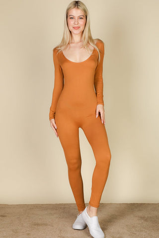 Model wearing a scoop neck long sleeve bodycon jumpsuit in soft, high stretch jersey fabric, showcasing a chic and comfortable style.