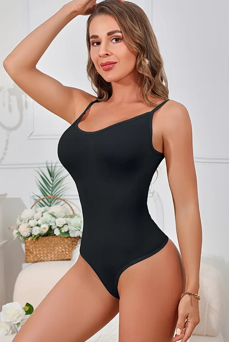 Woman wearing a seamless black bodysuit demonstrating tummy control, butt lifting, and hip support for a flattering silhouette.