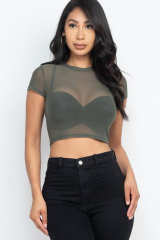 Woman wearing sexy mesh sheer short sleeve crop top, made of 90% polyester and 10% spandex, in olive green color.