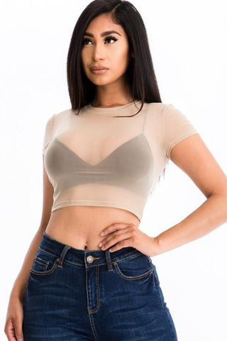 Woman wearing a sexy mesh sheer crop top with short sleeves, light and soft fabric, ideal for a trendy and stylish look.