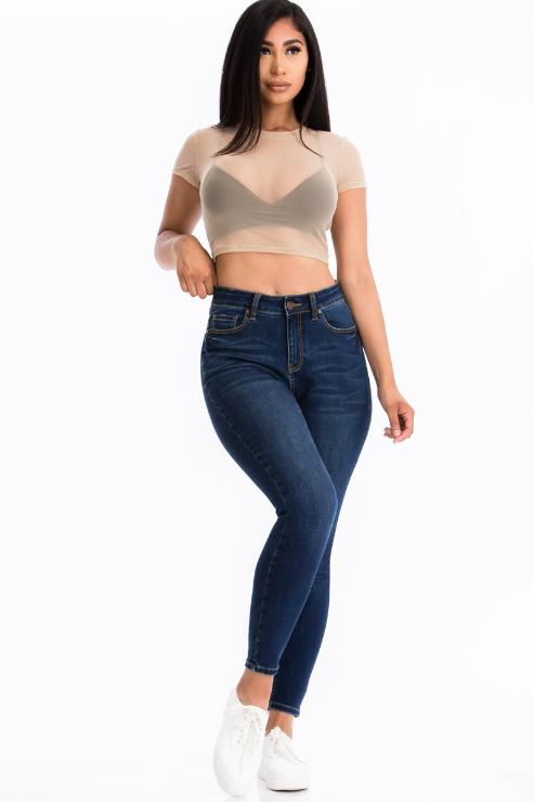 Woman wearing a sexy mesh sheer short sleeve crop top with jeans, model is 5'8". Soft, lightweight, 90% polyester, 10% spandex top.