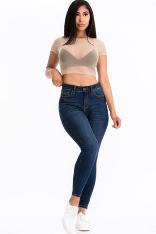 Woman wearing a sexy mesh sheer short sleeve crop top with jeans, model is 5'8". Soft, lightweight, 90% polyester, 10% spandex top.