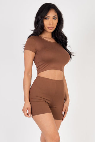 Brown short sleeve crop top and shorts set made of soft high-stretch jersey, 92% polyester, 8% spandex. Model is 5'8", wearing size small.