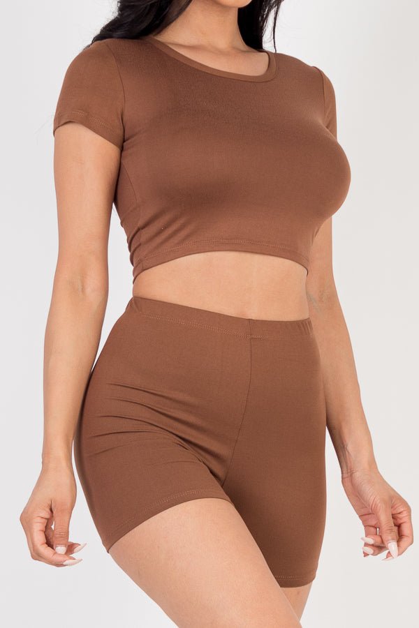 Woman wearing a brown short sleeve crop top and shorts set, made of soft, high stretch jersey fabric, ideal for casual wear.