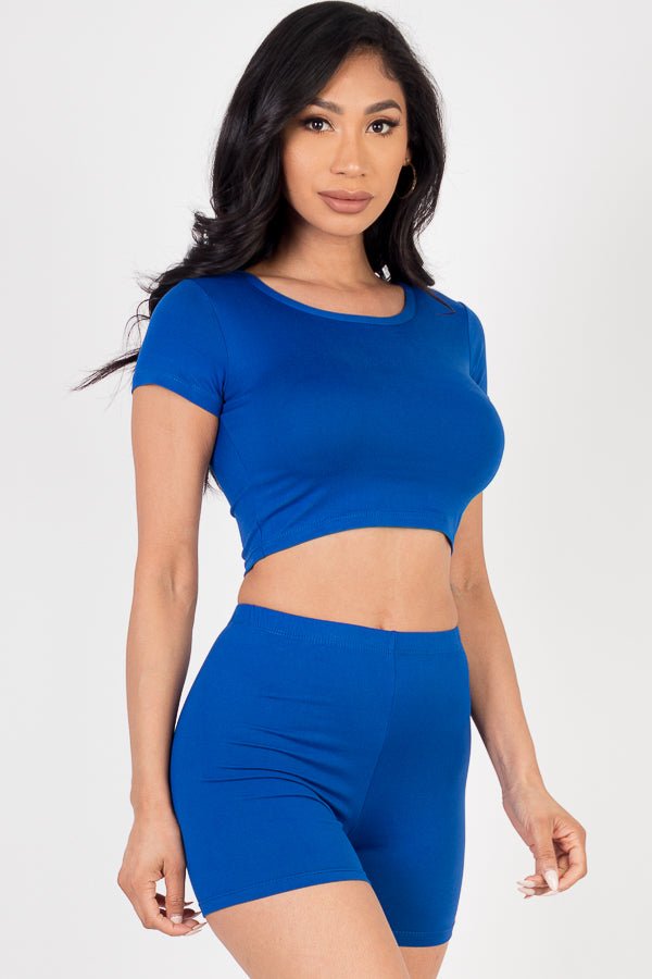 Model wearing blue short sleeve crop top and shorts set, made from soft, lightweight, high stretch jersey with polyester and spandex.