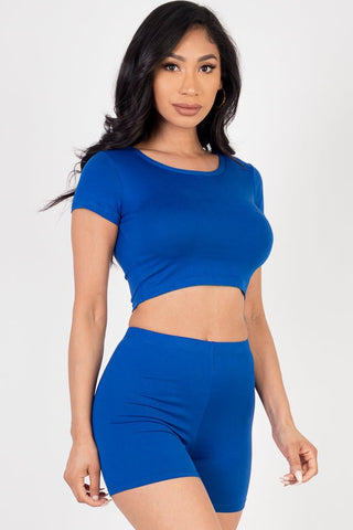 Model wearing blue short sleeve crop top and shorts set, made from soft, lightweight, high stretch jersey with polyester and spandex.