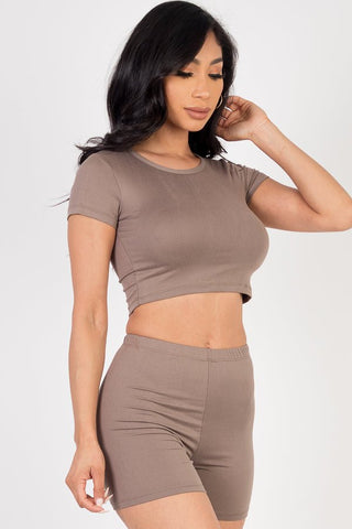 Model wearing beige short sleeve crop top and shorts set with high stretch jersey fabric, perfect for casual wear, front view.