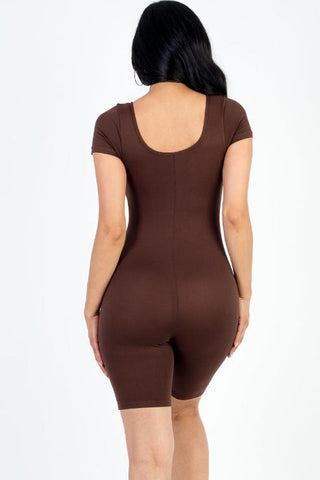 Back view of model wearing brown short sleeve scoop neck bodycon romper, showcasing tight fit and stretchy fabric, Polyester-Spandex blend.