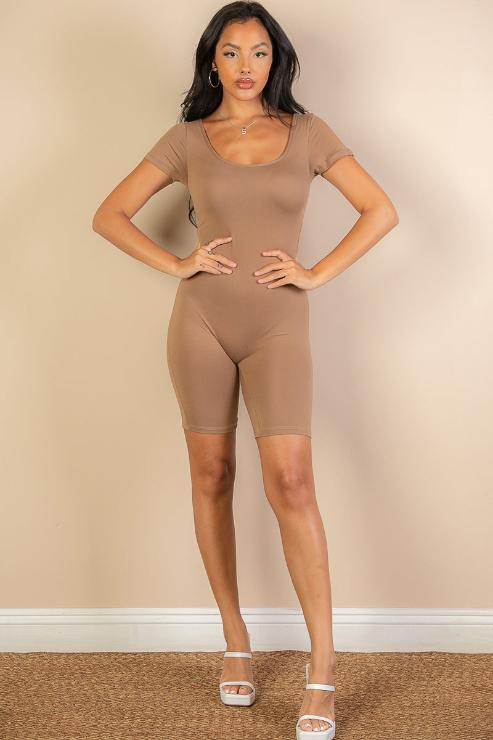 Model wearing short sleeve scoop neck bodycon romper in beige, 92% polyester 8% spandex, showcasing tight and comfortable fit.