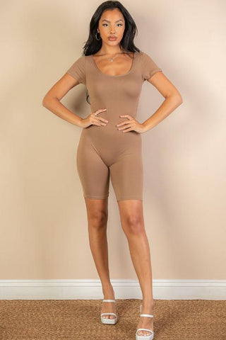 Model wearing short sleeve scoop neck bodycon romper in beige, 92% polyester 8% spandex, showcasing tight and comfortable fit.