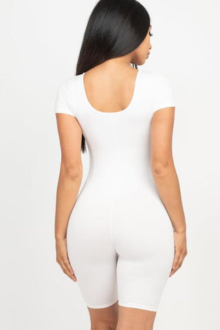 Back view of a woman wearing a white short sleeve scoop neck bodycon romper, emphasizing sleek fit and style.