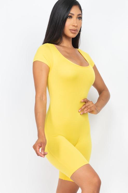 Model wearing a yellow short sleeve scoop neck bodycon romper, showcasing a tight yet comfortable fit made from polyester and spandex blend.