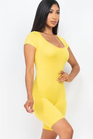 Model wearing a yellow short sleeve scoop neck bodycon romper, showcasing a tight yet comfortable fit made from polyester and spandex blend.