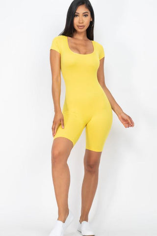 Yellow short sleeve scoop neck bodycon romper modeled, showcasing lightweight, stretchy fabric ideal for a snug yet comfy fit.