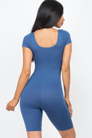 Back view of woman wearing blue short sleeve scoop neck bodycon romper, showcasing lightweight, stretchy fabric for a snug fit.