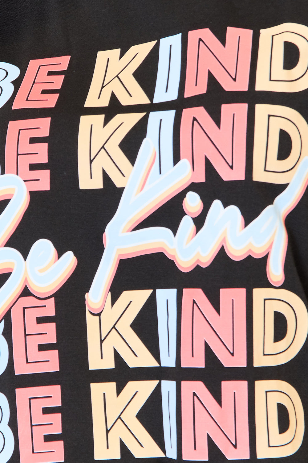 Graphic "BE KIND" design on black round neck T-shirt with colorful lettering.