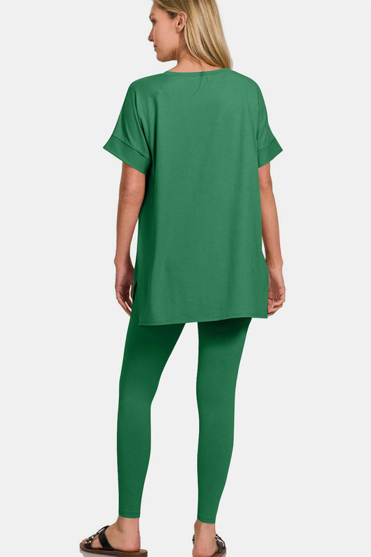 Woman wearing green V-neck rolled short sleeve T-shirt and leggings lounge set, showcasing back view of comfortable chic outfit.