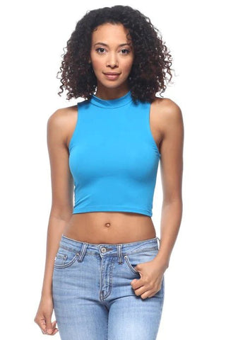Blue sleeveless mock neck crop top in stretch knit fabric, featuring a fitted design and solid color, worn by a model in jeans.