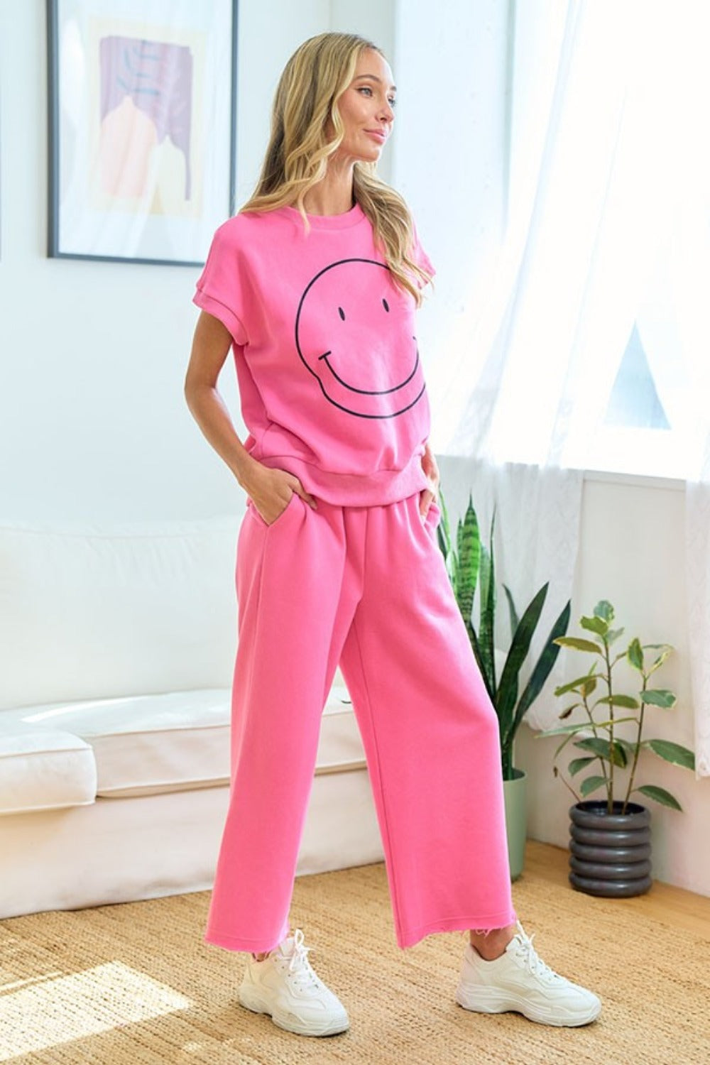 Pink smiley face T-shirt and pants set, perfect for casual wear, featuring a relaxed fit and stylish design for everyday comfort.