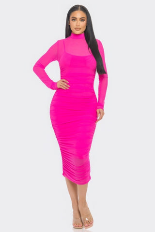 Pink ruched midi dress with long sleeves and smock neck, showcasing a flattering silhouette.