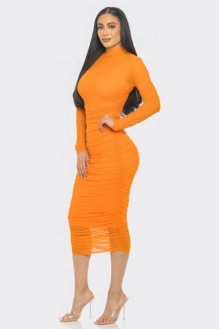 Elegant orange ruched midi dress with smock neck and long sleeves, showcasing a flattering silhouette for any occasion.