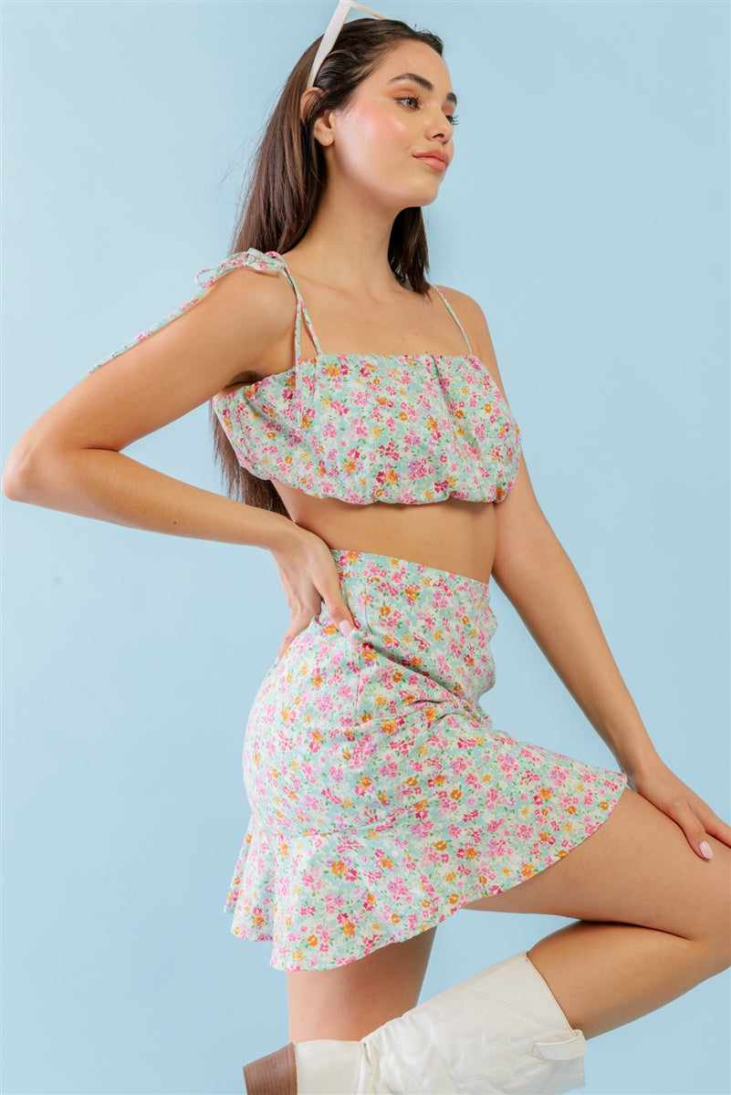 Floral strappy crop top and high waist mini skirt set in mint fuchsia print, featuring a cute, trendy sleeveless design.